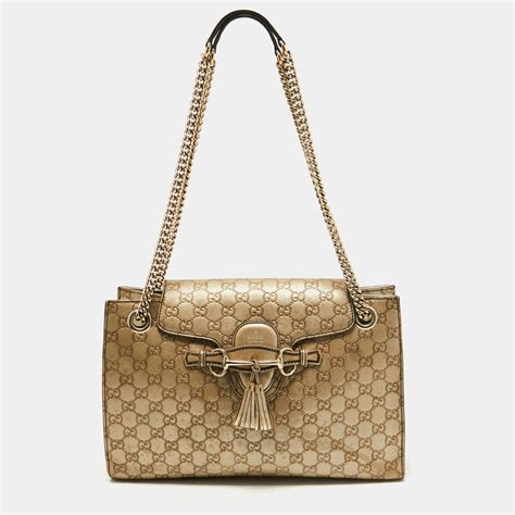 black gucci bag with goldchian and gold bugs|Gucci emily shoulder bag.